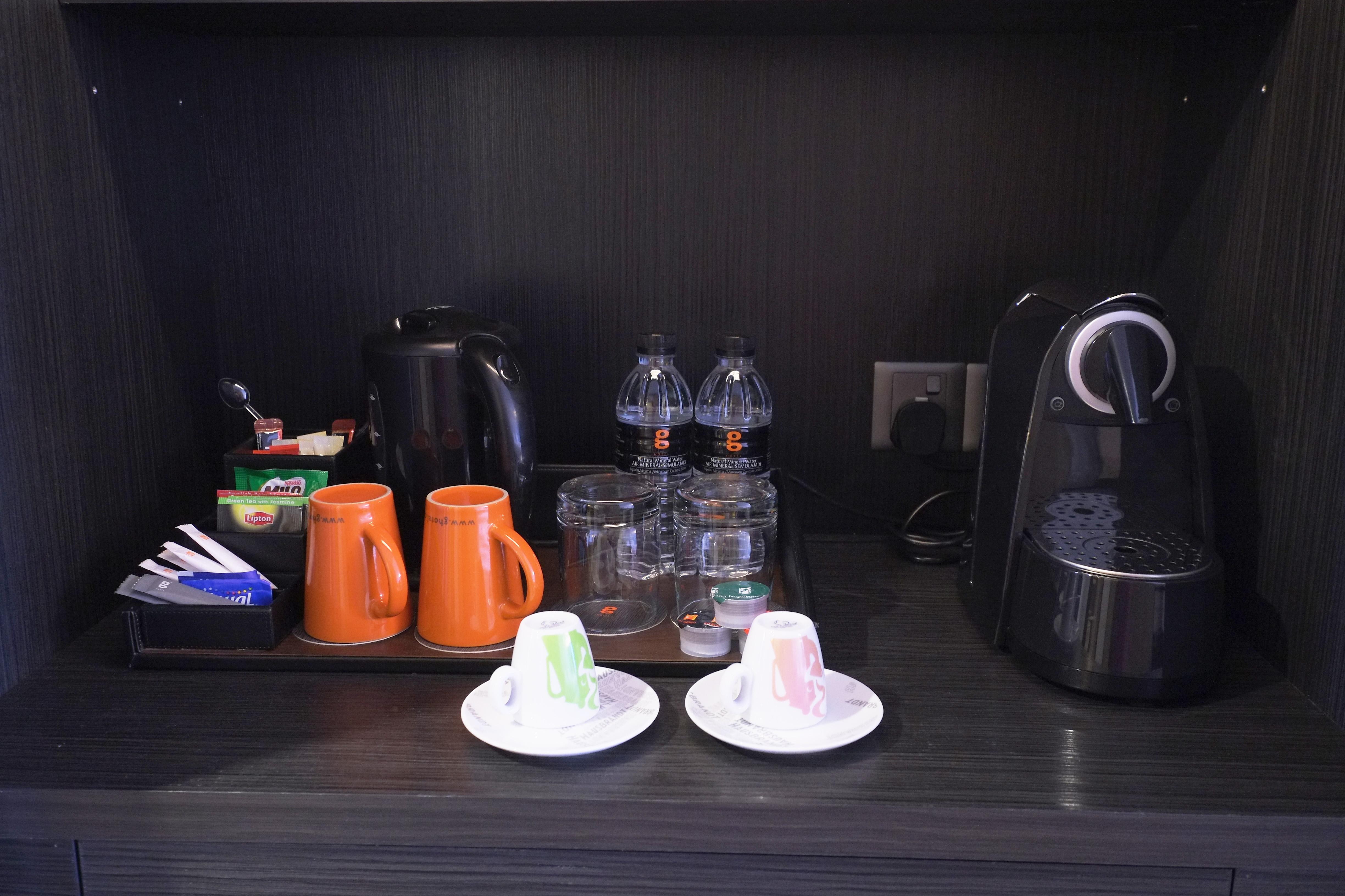 G Hotel Gurney George Town Exterior photo A Nespresso machine in a hotel room